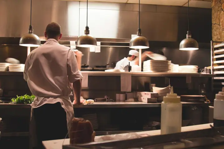Chef cooking in kitchen — Restaurant & Cafe, Lahore